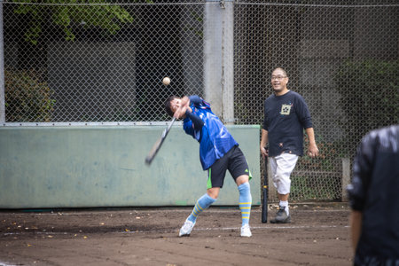 Tokyo, Japan, October 31, 2023: People Playing Baseball in a Public Parkのeditorial素材