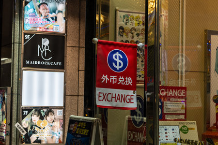 Tokyo, Japan, October 31, 2023: Currency exchange service sign hanging outside a building in Tokyoのeditorial素材