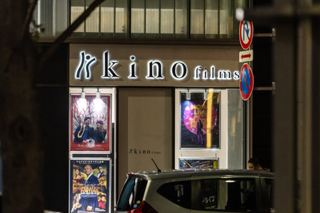 Tokyo, Japan, October 31, 2023: Facade of Kino Films office at night with movie postersのeditorial素材
