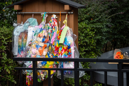 Tokyo, Japan, October 31, 2023: Colorful paper cranes on display at a public memorial siteのeditorial素材