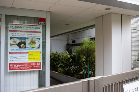 Tokyo, Japan, October 31, 2023: Public health announcement on vaccination posted outside a clinicのeditorial素材