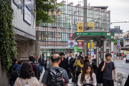 Tokyo, Japan, October 31, 2023: Crowded street near a subway entrance