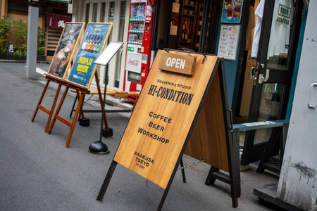 Tokyo, Japan, October 31, 2023: Sidewalk signboard outside a coffee and beer workshopのeditorial素材