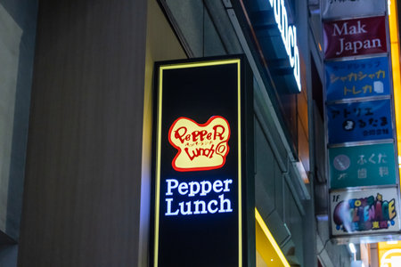Tokyo, Japan, October 31, 2023: Pepper Lunch restaurant sign illuminated at night in Tokyoのeditorial素材