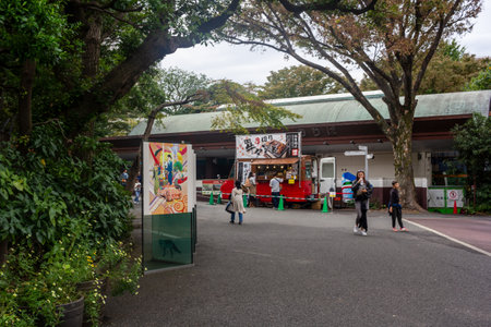 Tokyo, Japan, October 31, 2023: Visitors walking in Ueno Zoo near a food standのeditorial素材