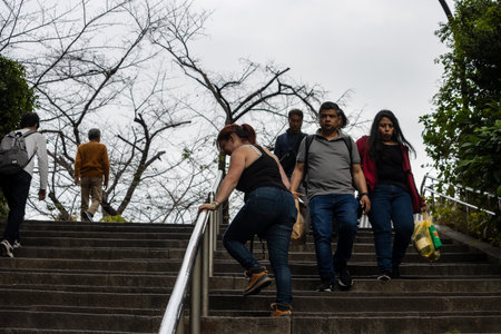 Tokyo, Japan, October 31, 2023: People climbing stairs in an outdoor public areaのeditorial素材