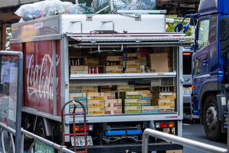 Tokyo, Japan, November 1, 2023: Delivery truck stocked with goods, including Coca-Cola, on city streetのeditorial素材