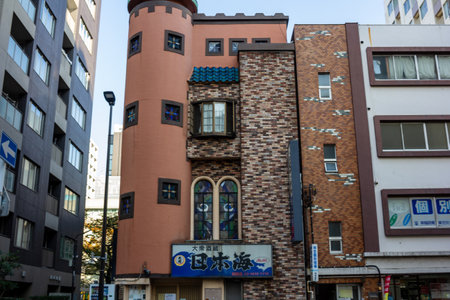 Tokyo, Japan, November 1, 2023: Unique architecture of a narrow building in Tokyo's urban areaのeditorial素材