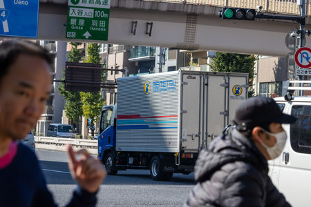 Tokyo, Japan, November 1, 2023: Busy Tokyo street with pedestrians and a delivery truckのeditorial素材