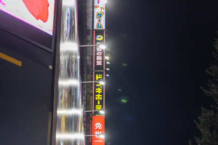 Tokyo, Japan, October 31, 2023: Illuminated signs at night in Tokyo's vibrant shopping districtのeditorial素材