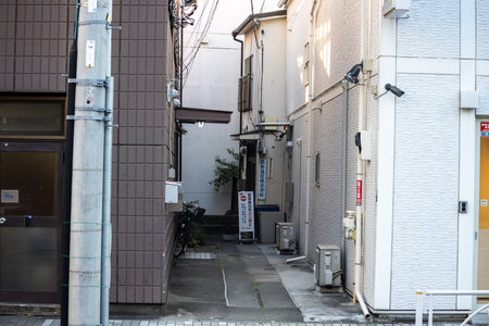 Tokyo, Japan, November 1, 2023: Narrow alleyway between buildings in Tokyoのeditorial素材