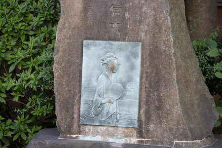 Tokyo, Japan, November 1, 2023: Stone monument with a bas-relief in a Tokyo parkのeditorial素材