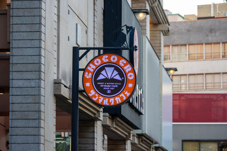 Tokyo, Japan, November 1, 2023: Iconic orange sign of a Hub British pub on a Tokyo streetのeditorial素材