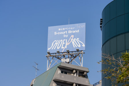 Tokyo, Japan, November 1, 2023: Rooftop billboard advertising 'SHOE BROS' in Tokyo's skylineのeditorial素材