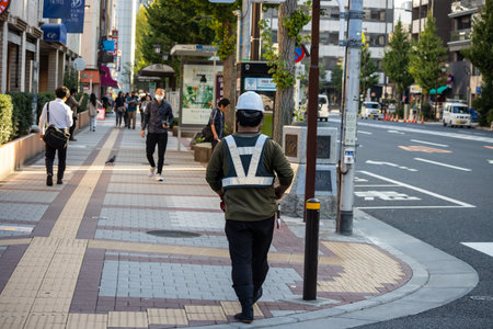 Tokyo, Japan, November 1, 2023: People Waiting at Pedestrian Crossing in Tokyoのeditorial素材
