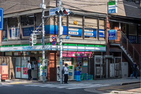 Tokyo, Japan, November 1, 2023: Street corner with convenience store and dental clinic aboveのeditorial素材
