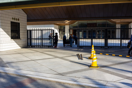 Tokyo, Japan, November 1, 2023: Entrance of a public building with people gathered
