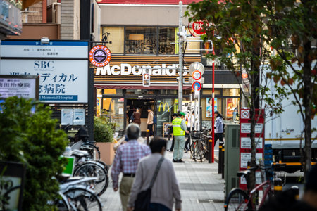 Tokyo, Japan, November 1, 2023: Street view with McDonald's and SBC sign in the busy shopping areaのeditorial素材