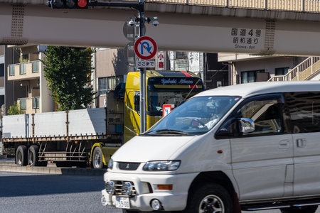 Tokyo, Japan, November 1, 2023: Van and Trailer Under Expressway in Tokyoのeditorial素材