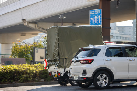 Tokyo, Japan, November 1, 2023: White SUV driving under an overpass in Tokyoのeditorial素材