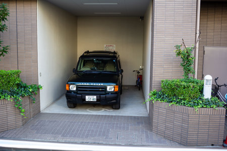 Tokyo, Japan, November 1, 2023: SUV Parked in a Tight Residential Garageのeditorial素材