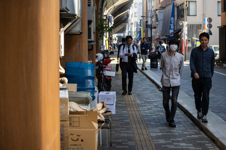 Tokyo, Japan, November 1, 2023: People Walking on a Busy Street in Tokyoのeditorial素材