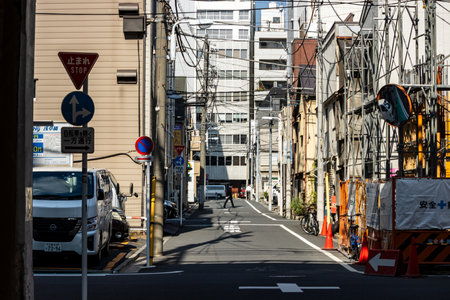 Tokyo, Japan, November 1, 2023: View of a Backstreet with Utility Poles in Tokyoのeditorial素材