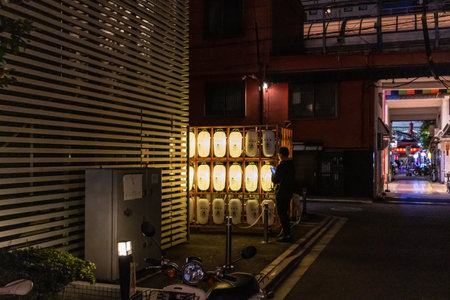 Tokyo, Japan, November 1, 2023: Night View of a Tokyo Alley with Illuminated Lanternsのeditorial素材
