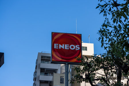 Tokyo, Japan, November 1, 2023: ENEOS Gasoline Station Sign Above Buildings