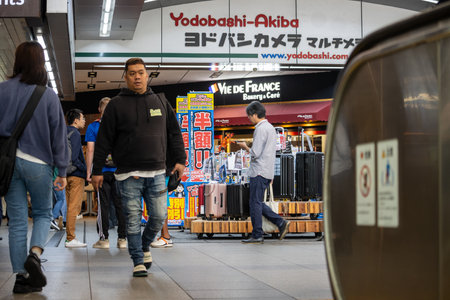 Tokyo, Japan, November 1, 2023: Shoppers Walking Past Yodobashi Camera Store