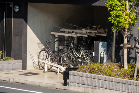Tokyo, Japan, November 1, 2023: Bicycle Parking Area Outside a Modern Buildingのeditorial素材