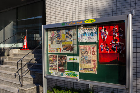 Tokyo, Japan, November 1, 2023: Community Bulletin Board with Posters and Announcementsのeditorial素材