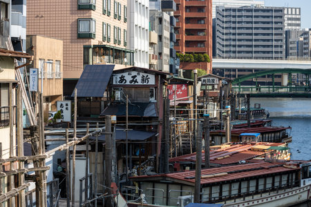 Tokyo, Japan, November 1, 2023: Traditional Buildings Alongside a Canal in Tokyoのeditorial素材