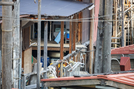 Tokyo, Japan, November 1, 2023: View of a small house and its interior near a canal with personal items visibleのeditorial素材
