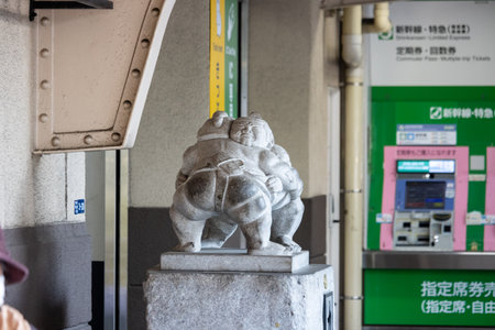 Tokyo, Japan, November 1, 2023: Stone statue at the entrance of a subway stationのeditorial素材