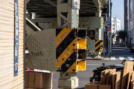 Tokyo, Japan, November 1, 2023: Cardboard boxes stacked under a bridge for recycling