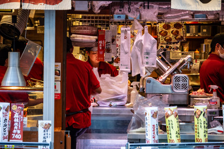 Tokyo, Japan, November 1, 2023: Chef preparing food in a street-side restaurant in Tokyoのeditorial素材