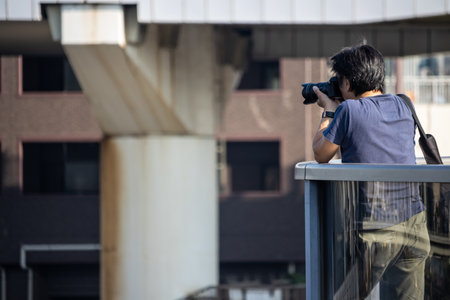 Tokyo, Japan, November 1, 2023: Photographer Capturing Urban Landscapeのeditorial素材