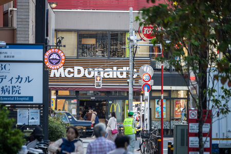 Tokyo, Japan, November 1, 2023: Busy street view with multiple store signs including McDonald'sのeditorial素材