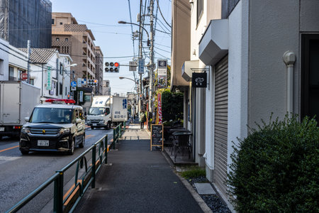 Tokyo, Japan, November 2, 2023: Ambulance responding to an emergency in Minato Districtのeditorial素材