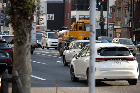Tokyo, Japan, November 2, 2023: Busy Street Scene with Variety of Vehicles and Pedestriansのeditorial素材