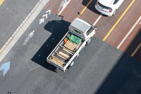 Tokyo, Japan, November 2, 2023: Aerial View of Delivery Truck and Car on City Streetのeditorial素材