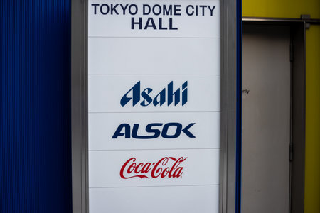 Tokyo, Japan, November 2, 2023: Advertising Signage Featuring Asahi, ALSOK, and Coca-Cola Brandsのeditorial素材