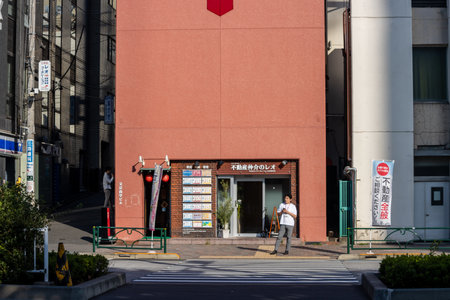 Tokyo, Japan, November 2, 2023: Entrance of a Local Restaurant and Pedestrian in Tokyo Streetのeditorial素材