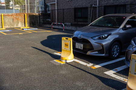 Tokyo, Japan, November 2, 2023: Parked Toyota Car and Reserved Parking Space in Urban Settingのeditorial素材
