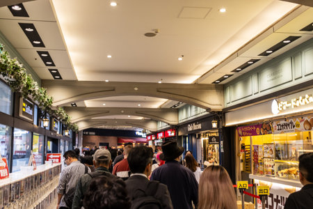 Tokyo, Japan, November 2, 2023: Crowded indoor shopping arcade with various stores and shoppersのeditorial素材