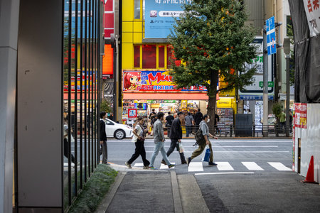 Tokyo, Japan, November 2, 2023: Bustling street scene near Shibuya with pedestrians and colorful billboardsのeditorial素材