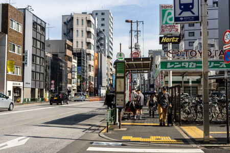 Tokyo, Japan, November 2, 2023: Busy street scene with pedestrians and branded signage in Nihonbashiのeditorial素材