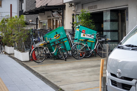 Tokyo, Japan, November 2, 2023: Delivery bicycles parked outside a restaurantのeditorial素材