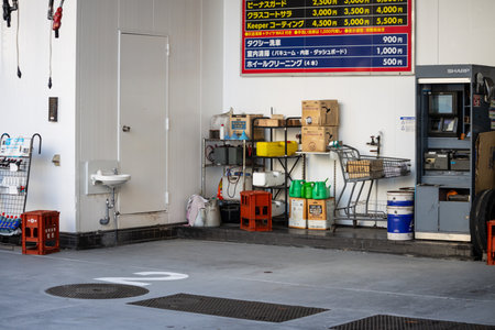 Tokyo, Japan, November 2, 2023: Interior view of a car maintenance garage with various equipmentのeditorial素材